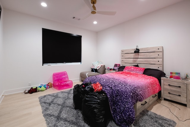 bedroom with ceiling fan and light wood-type flooring