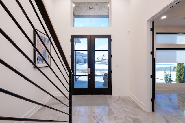 entryway featuring french doors and a healthy amount of sunlight