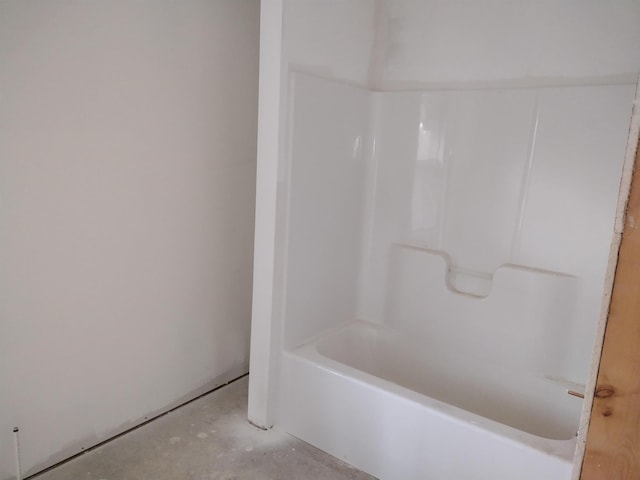 bathroom with concrete flooring