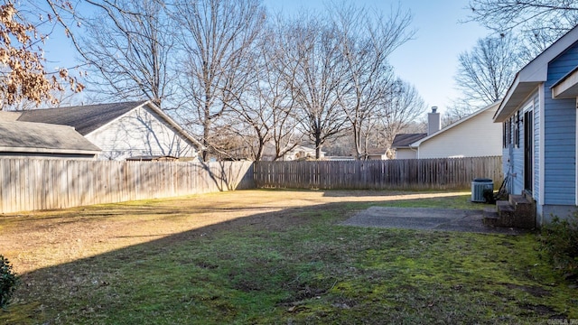 view of yard with a patio and central air condition unit