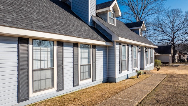 view of property exterior with a lawn