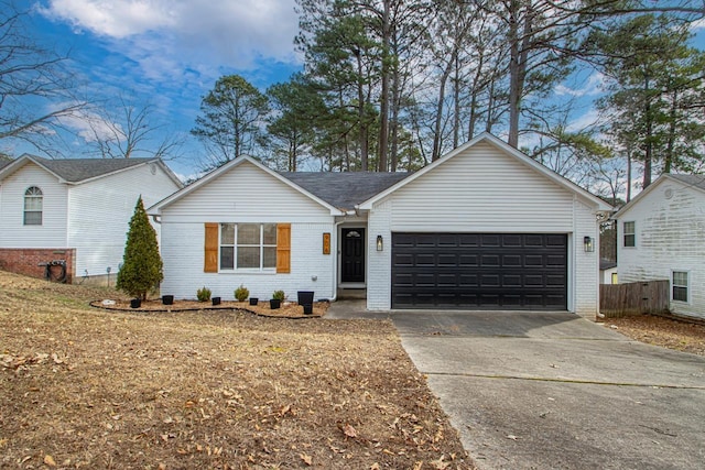 ranch-style home featuring a garage