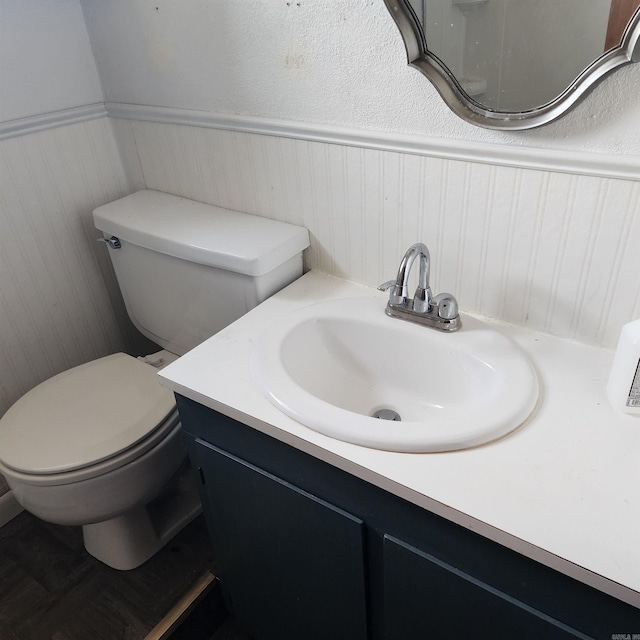 bathroom featuring vanity and toilet