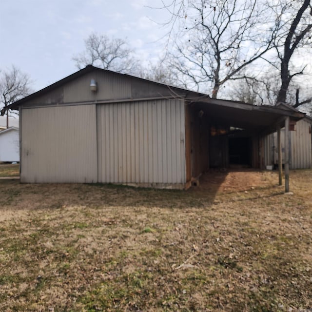 view of outbuilding with a yard