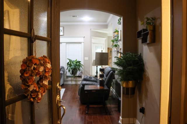 interior space featuring dark hardwood / wood-style flooring and crown molding