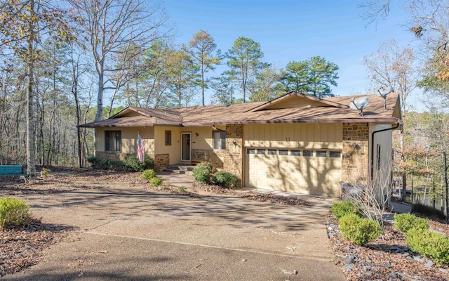 ranch-style home featuring a garage