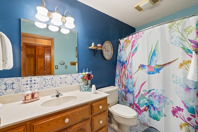 bathroom with vanity, a notable chandelier, toilet, a textured ceiling, and a shower with shower curtain