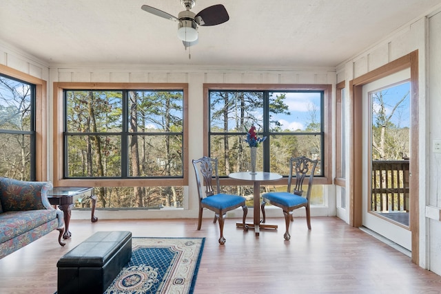 sunroom / solarium with ceiling fan