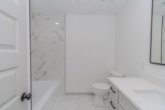 full bathroom featuring vanity, tiled shower / bath, and toilet