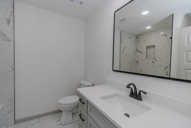 bathroom featuring vanity, toilet, and walk in shower