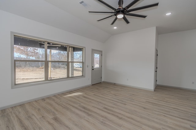 interior space with vaulted ceiling, ceiling fan, and light hardwood / wood-style floors