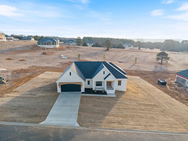 birds eye view of property with a rural view