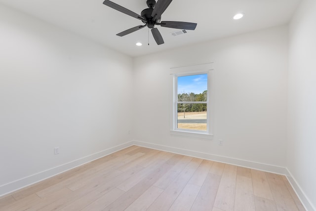 empty room featuring ceiling fan and light wood-type flooring