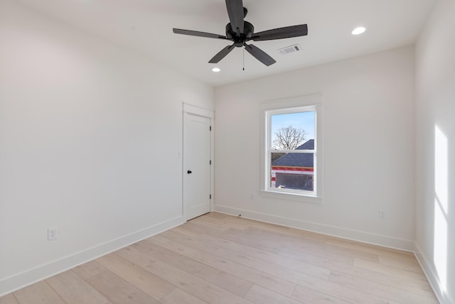 spare room featuring ceiling fan and light wood-type flooring