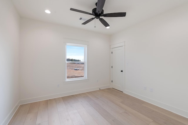 spare room featuring ceiling fan and light hardwood / wood-style floors