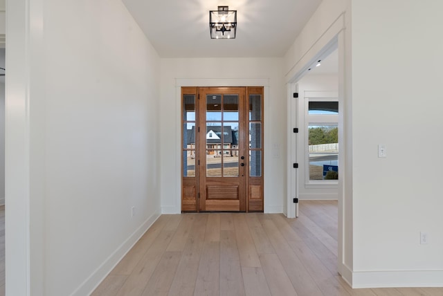 foyer with light hardwood / wood-style floors