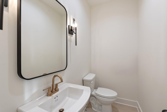 bathroom with sink and toilet