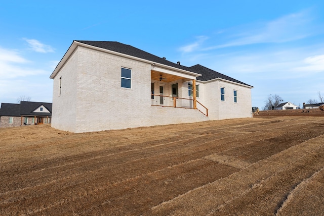 exterior space featuring a porch and a yard