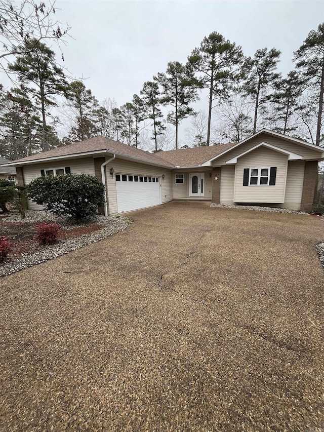 single story home featuring a garage