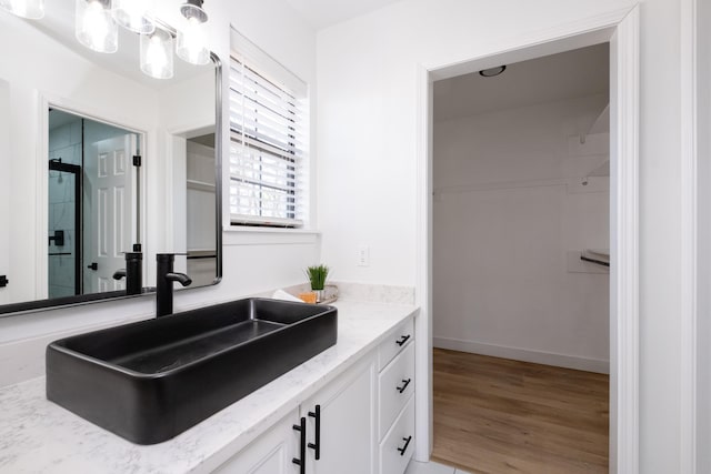 bathroom featuring vanity and wood-type flooring