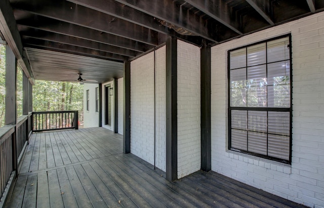 wooden terrace featuring ceiling fan