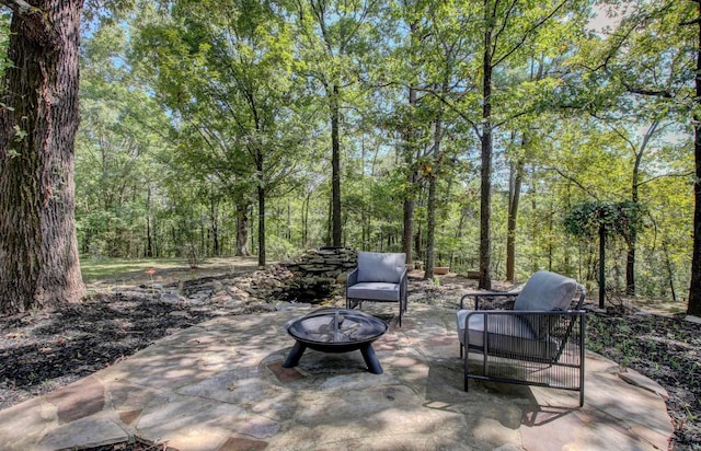 view of patio / terrace featuring an outdoor fire pit