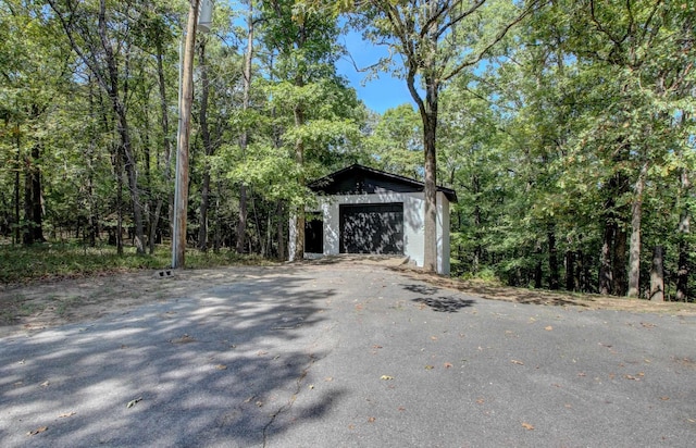 exterior space featuring an outbuilding and a garage