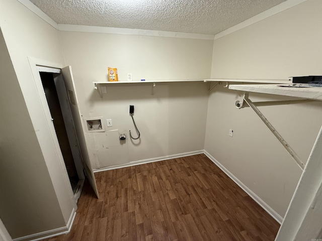 clothes washing area with washer hookup, dark hardwood / wood-style flooring, hookup for an electric dryer, and a textured ceiling