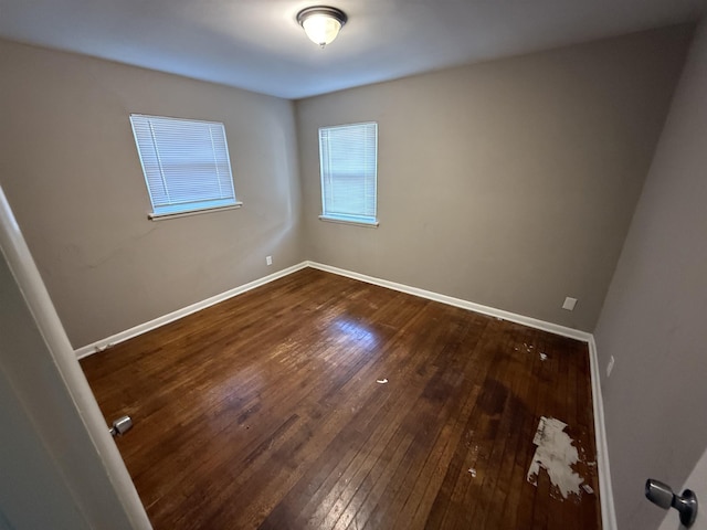 unfurnished room featuring hardwood / wood-style flooring