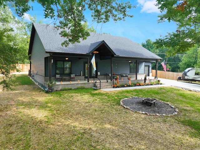 bungalow with a porch and a front yard