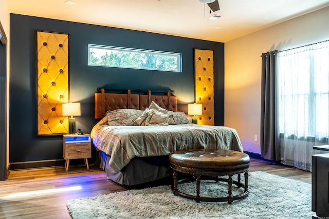 bedroom featuring hardwood / wood-style flooring and ceiling fan