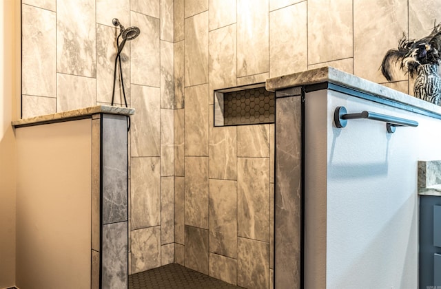 bathroom with tiled shower