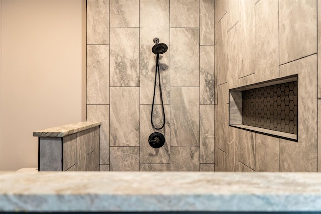 room details featuring a tile shower