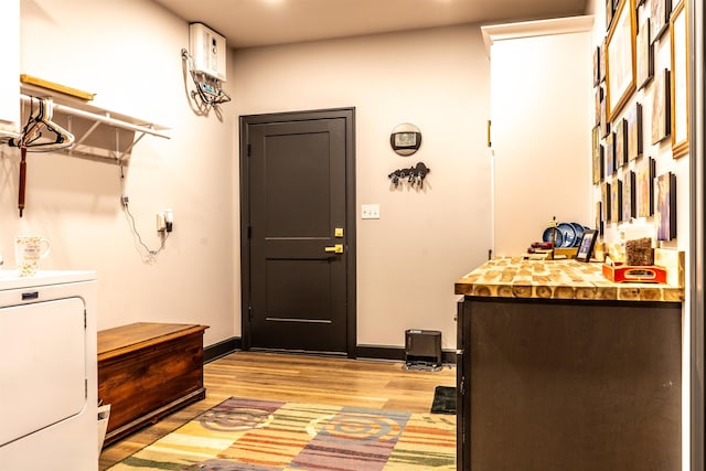 washroom featuring washer / clothes dryer and light wood-type flooring