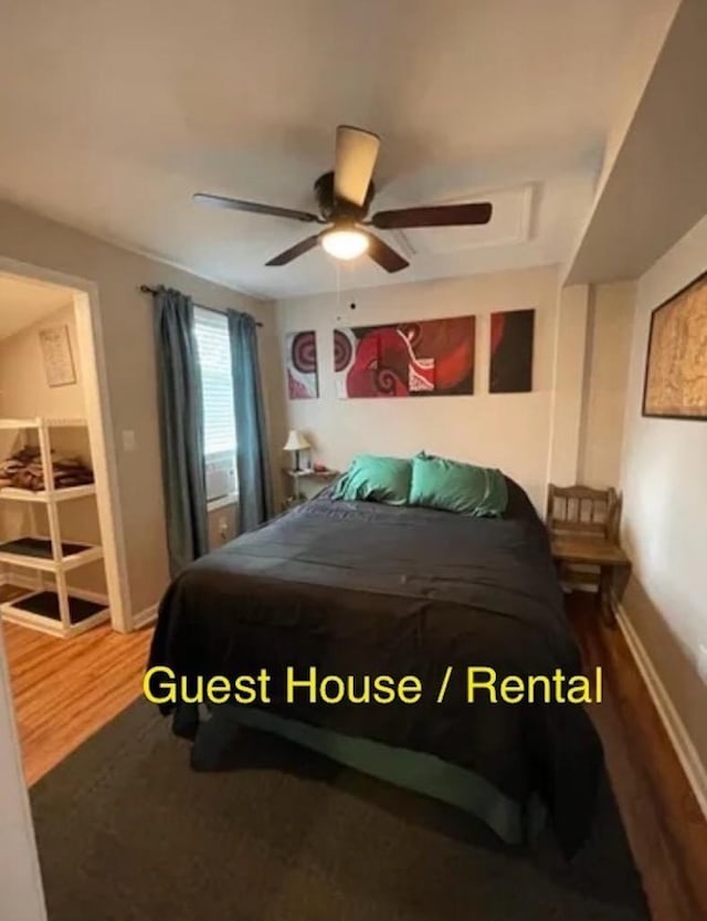 bedroom featuring wood-type flooring and ceiling fan