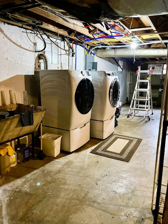 basement with separate washer and dryer and electric panel