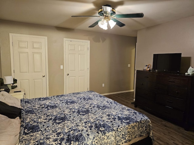 bedroom featuring dark wood-type flooring and ceiling fan