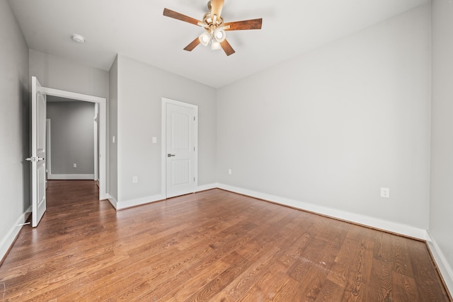 unfurnished bedroom featuring hardwood / wood-style flooring and ceiling fan