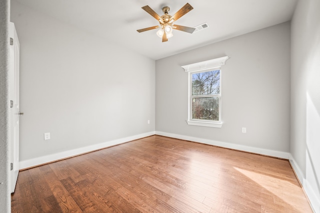 spare room with ceiling fan and light hardwood / wood-style floors