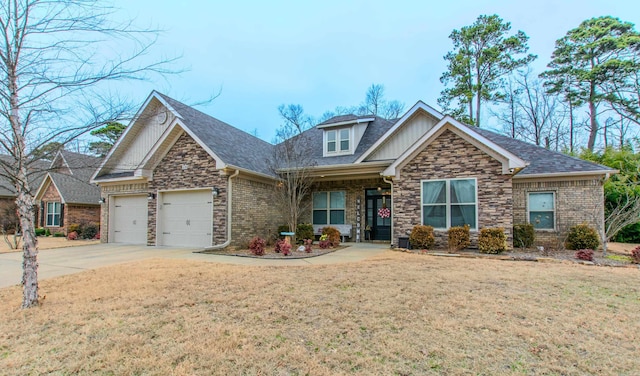 view of front facade with a garage and a front yard