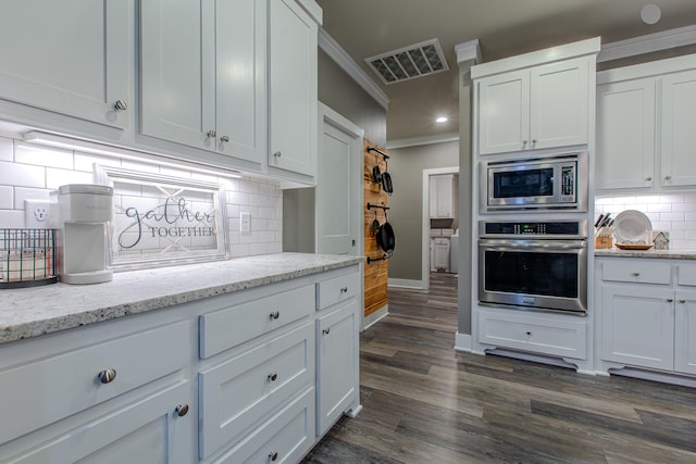 kitchen with stainless steel appliances and white cabinetry