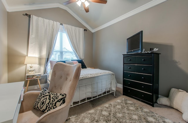 bedroom featuring vaulted ceiling, carpet, ornamental molding, and ceiling fan