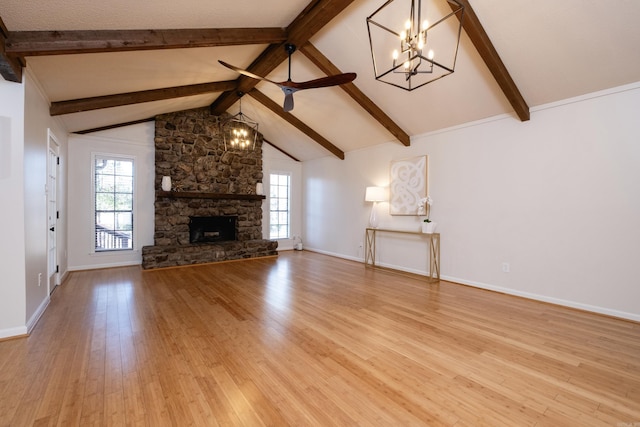 unfurnished living room featuring a fireplace, high vaulted ceiling, beam ceiling, and light wood-type flooring