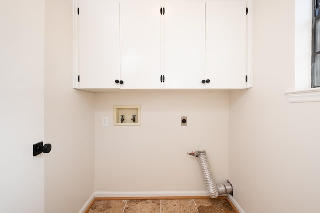 washroom with cabinets, hookup for an electric dryer, and hookup for a washing machine