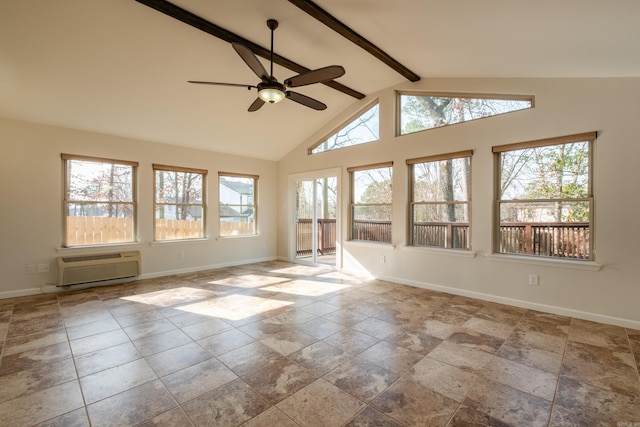 unfurnished sunroom with lofted ceiling with beams, a wall unit AC, and ceiling fan