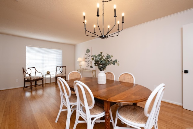 dining space with an inviting chandelier and light wood-type flooring