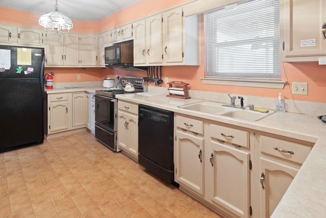 kitchen featuring hanging light fixtures, black appliances, sink, and a chandelier