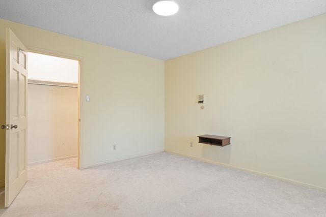 empty room featuring light colored carpet