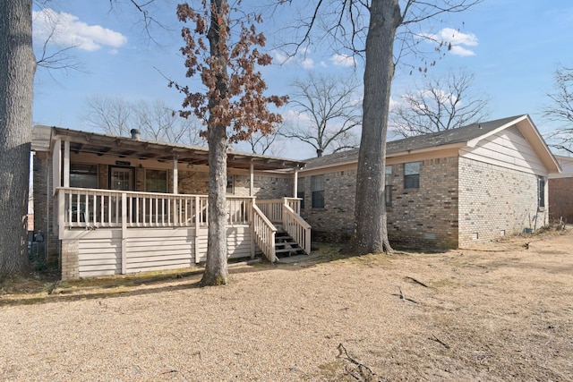 rear view of property featuring a porch