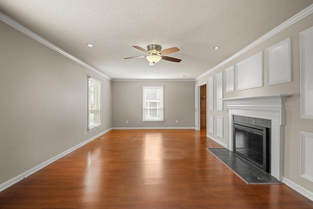 unfurnished living room featuring crown molding, hardwood / wood-style floors, and a textured ceiling